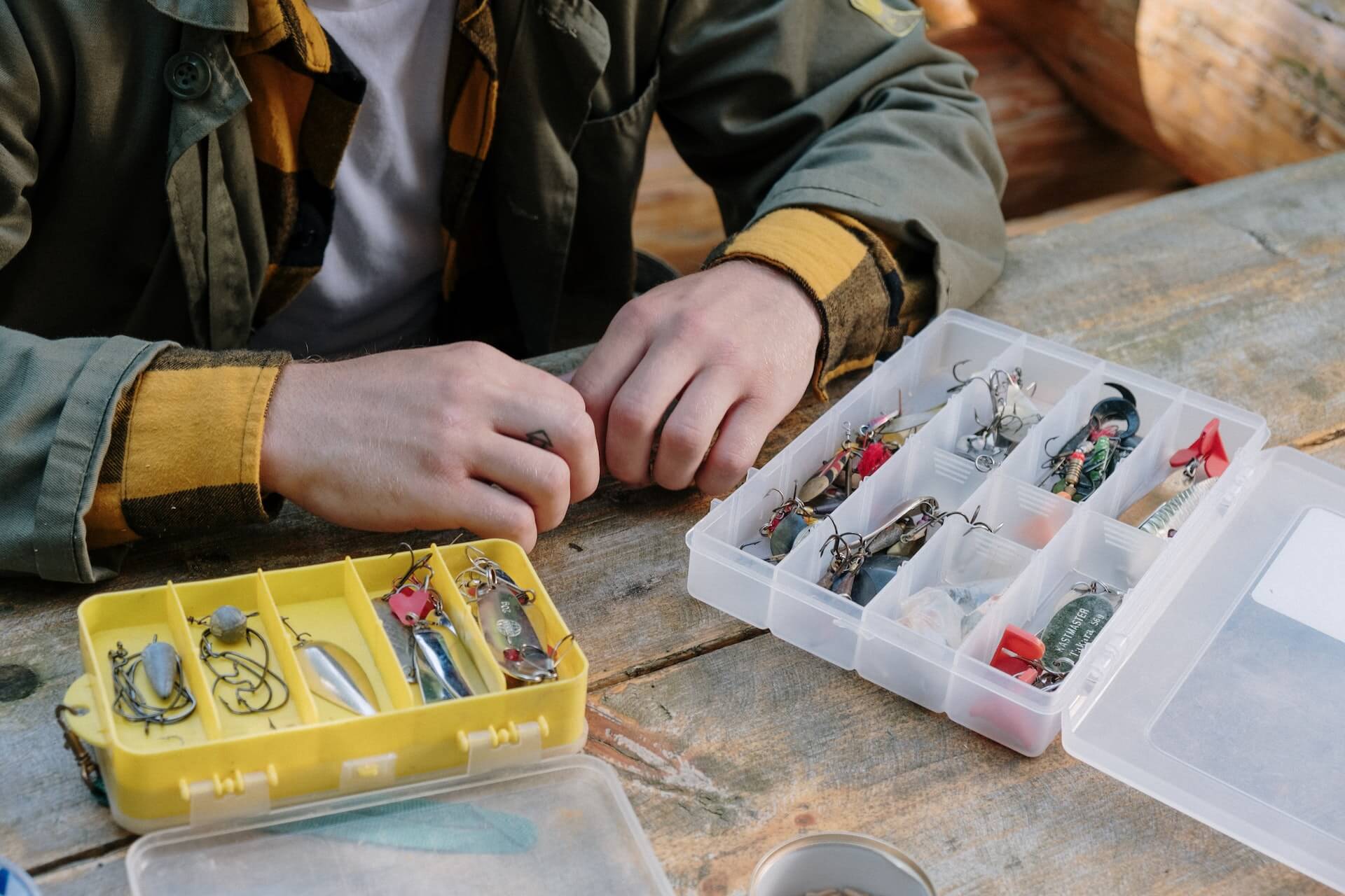 Person sorting through the fishing baits