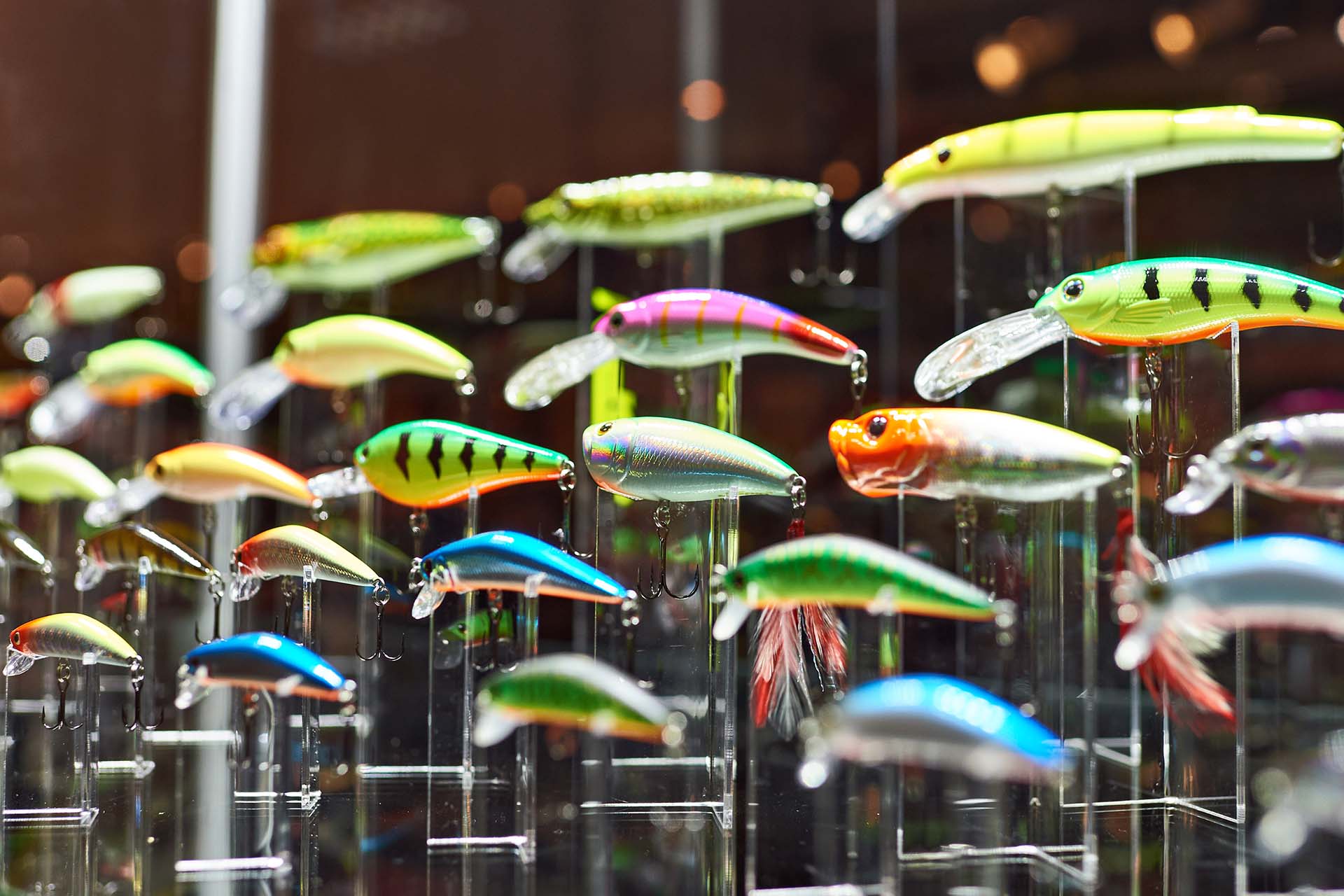 Different colorful plastic fishing baits in store