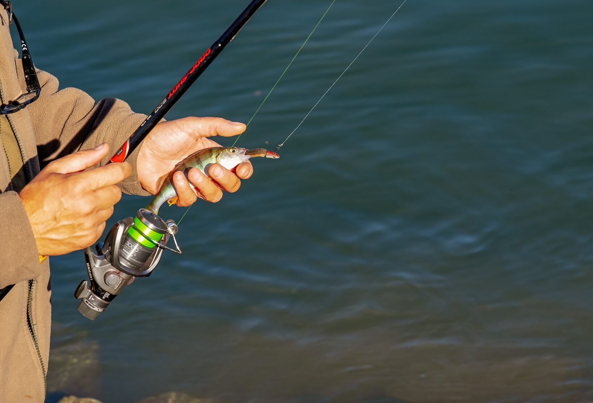 Man holding a fishing rod