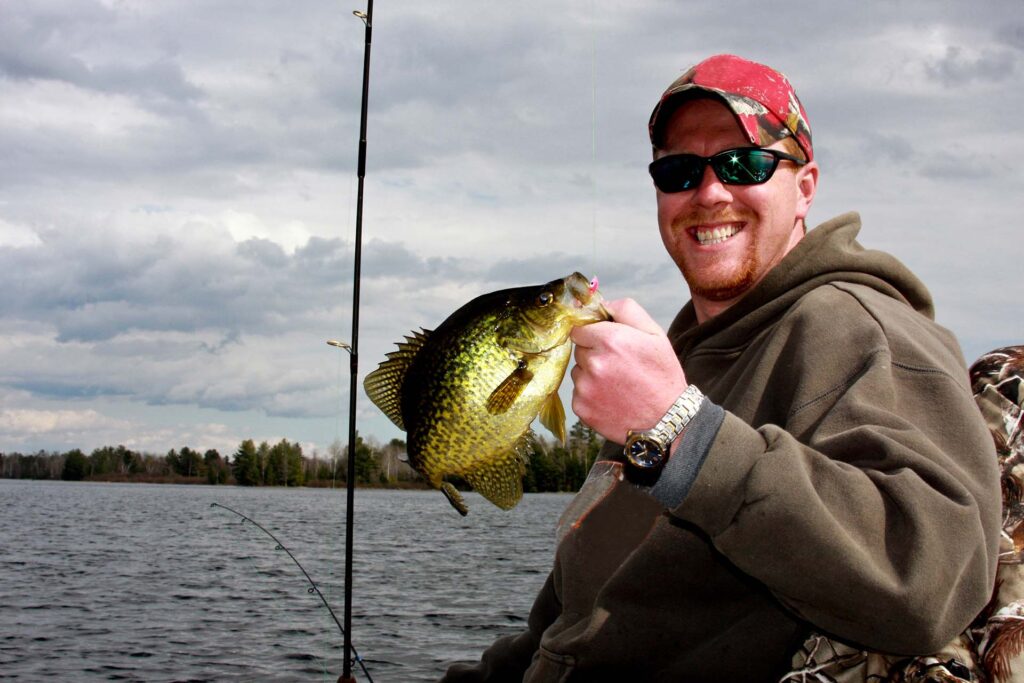 Fisherman holding a crappie