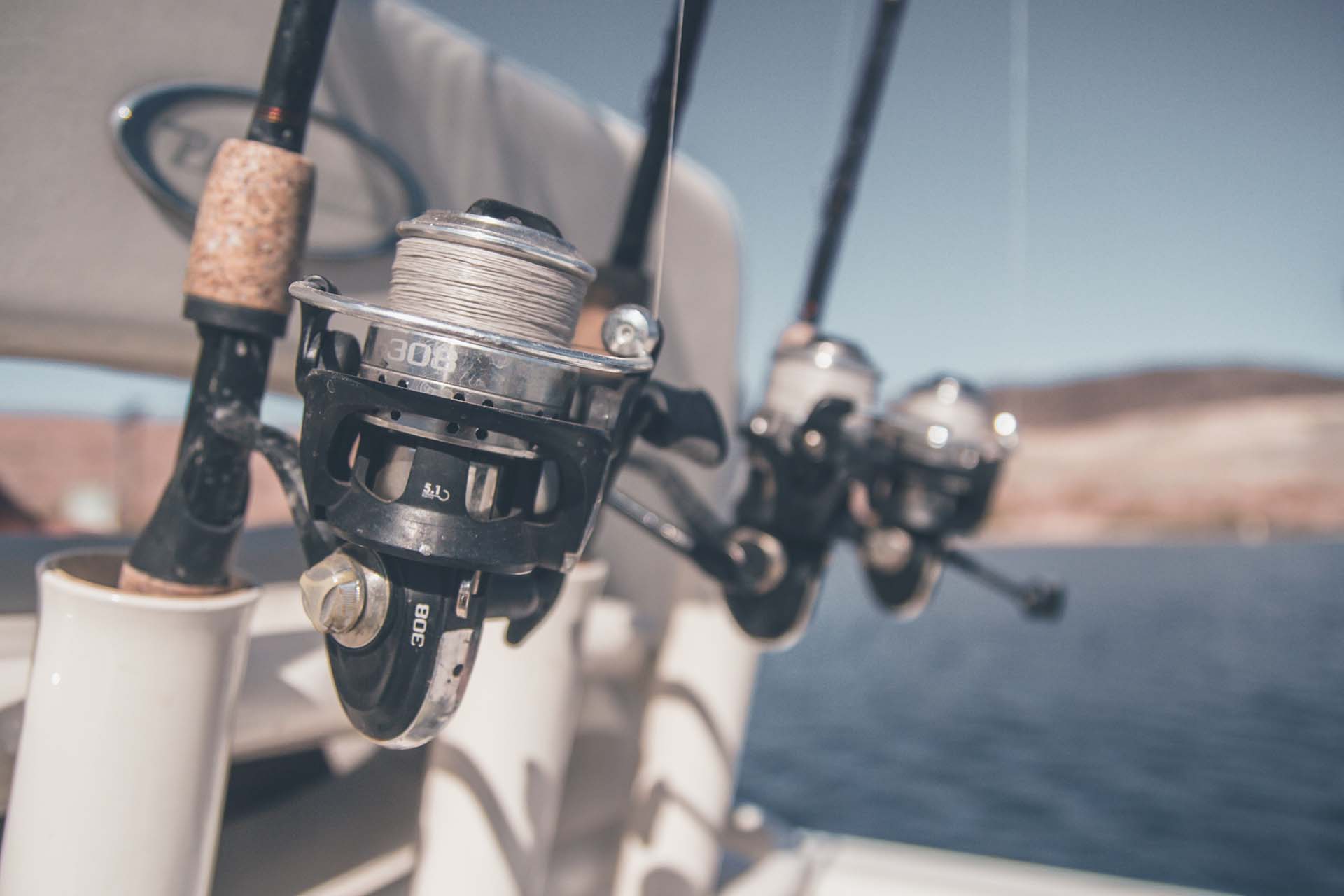 Fishing rods in holders attached to a boat