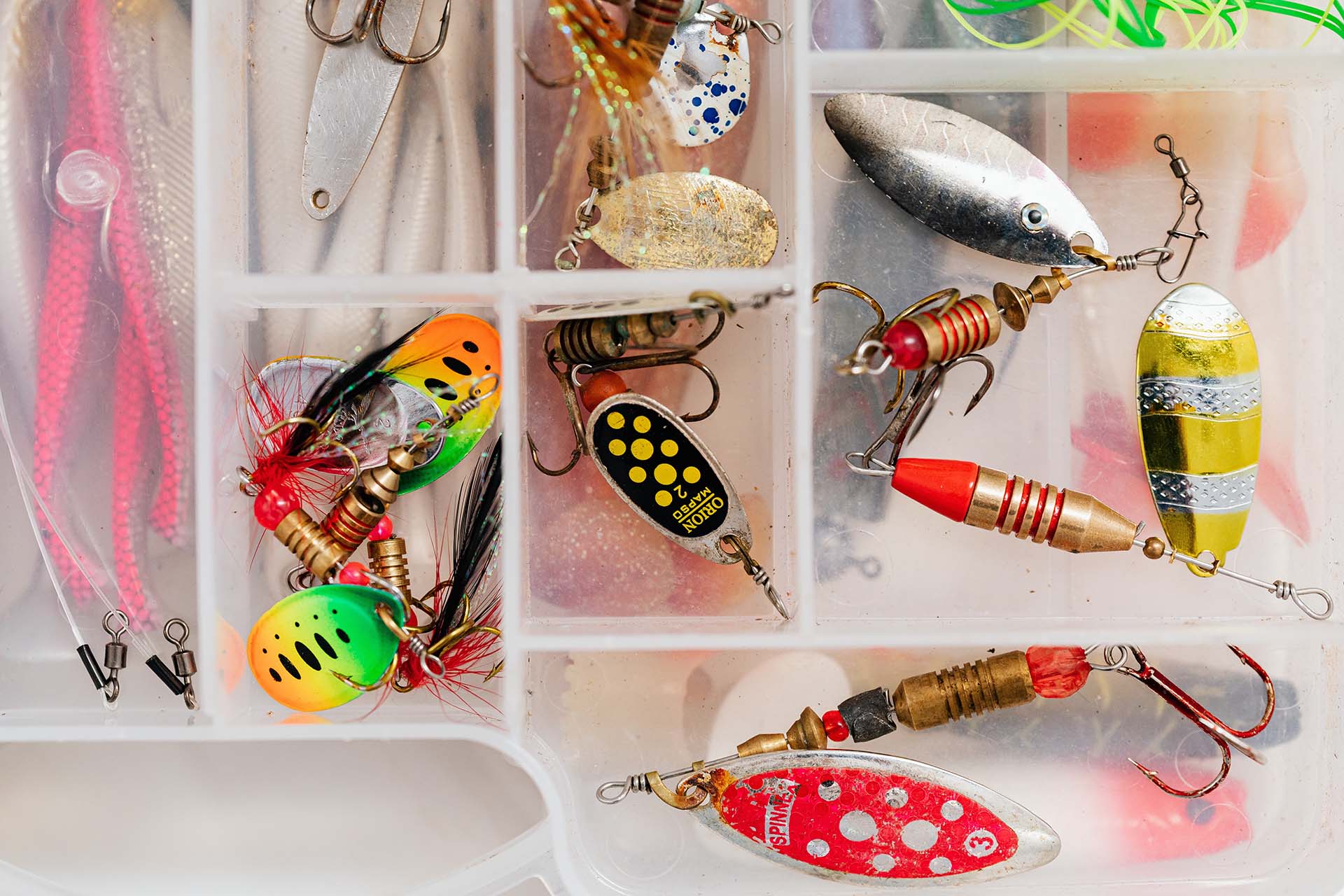 Tackle box with different lures and hooks