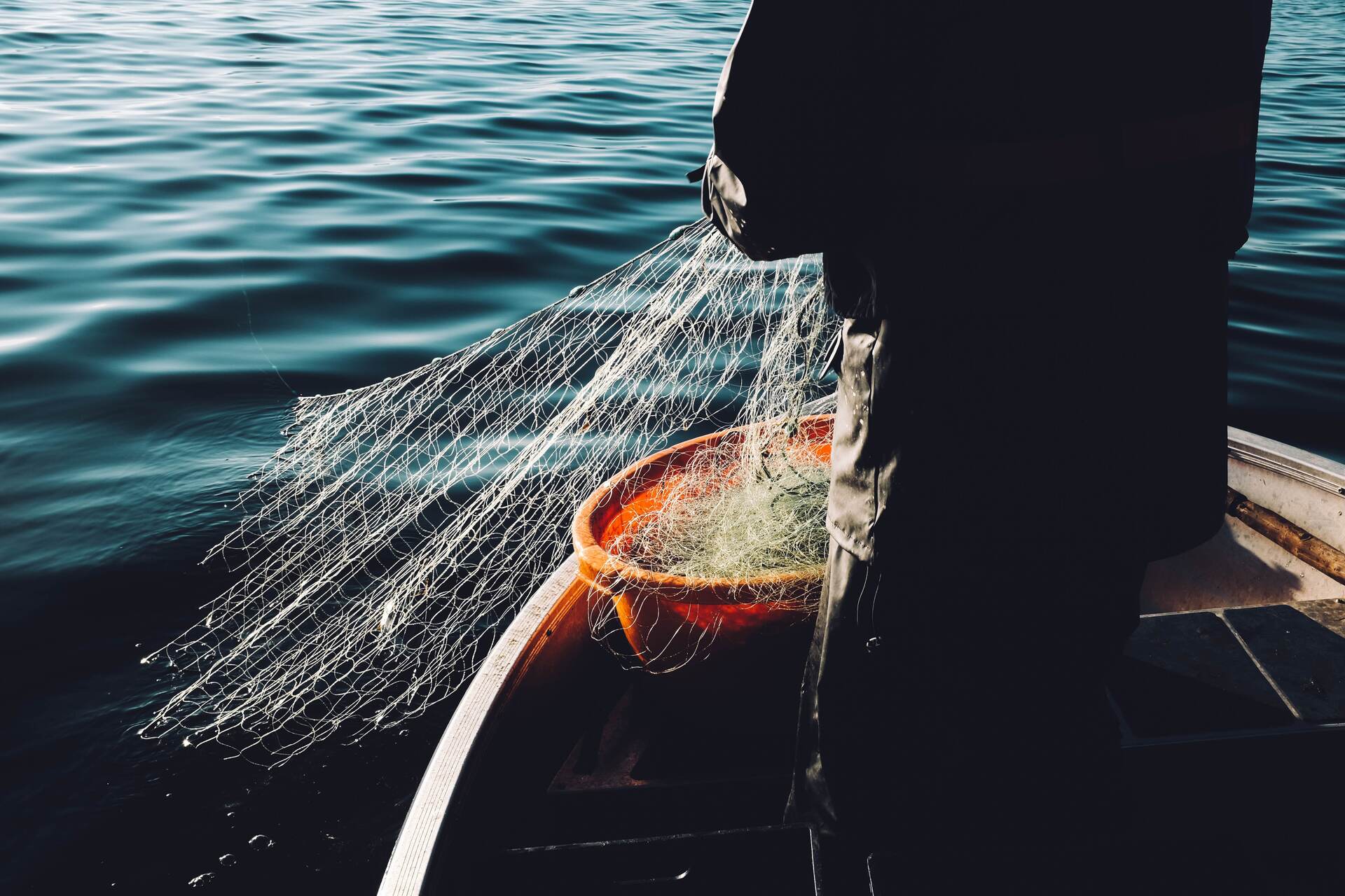 Fishermen on a boat with a net 