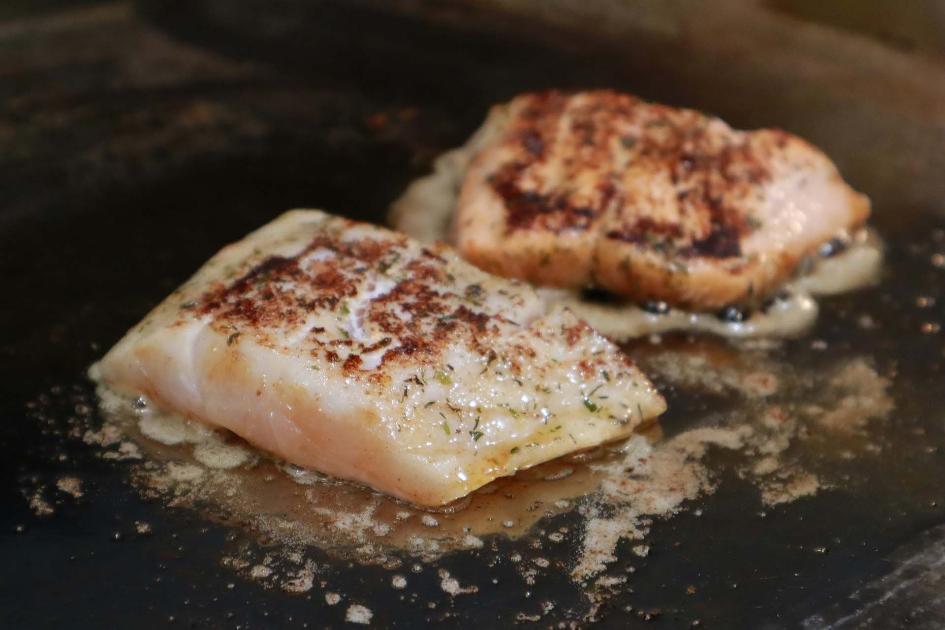White fish cooking in a pan