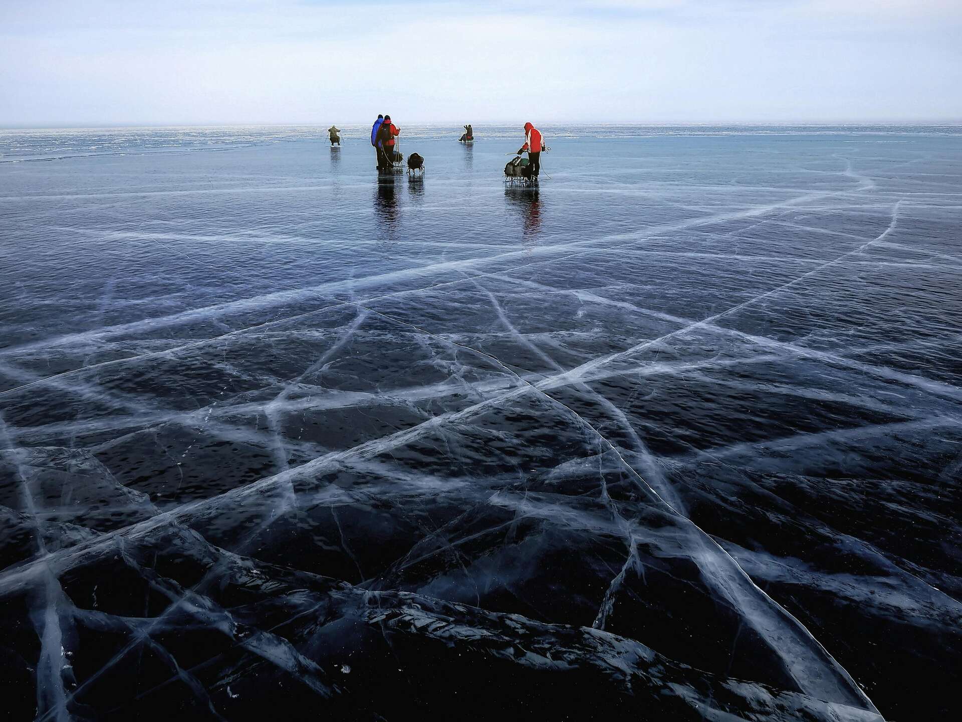 People standing on a frozen lake 