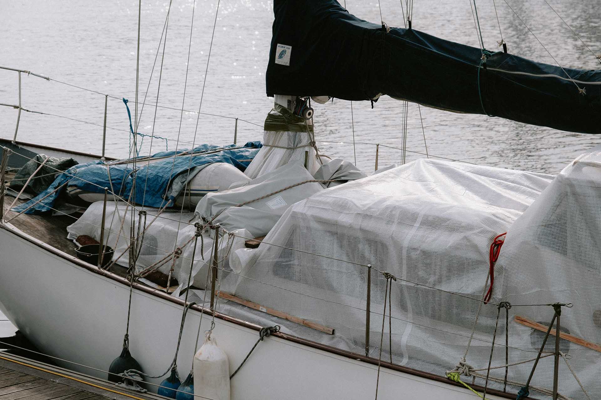 A boat in port covered with the cover