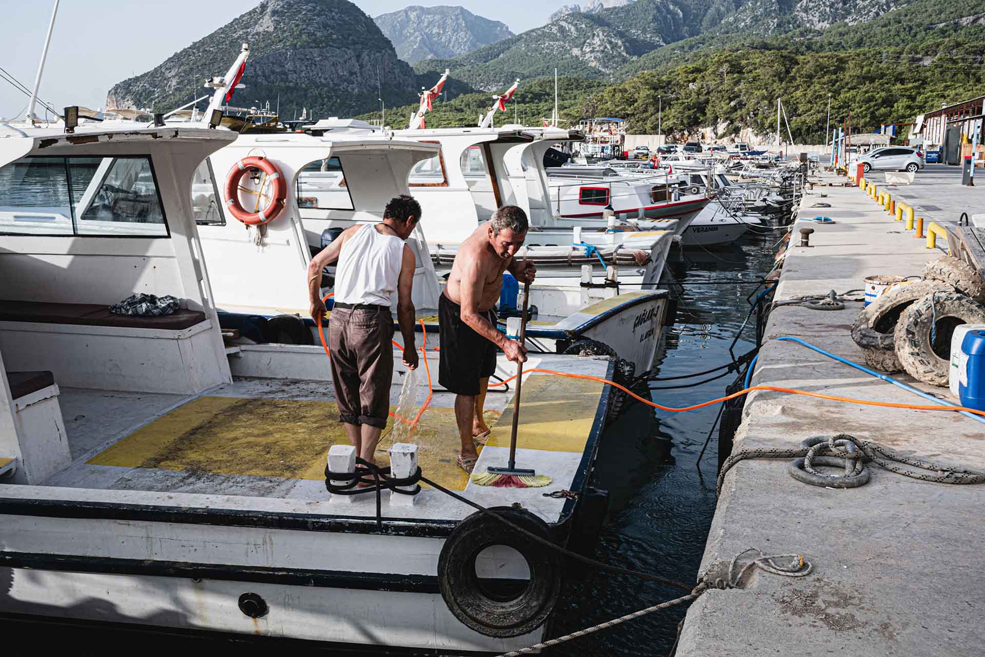 Men cleaning the boat deck