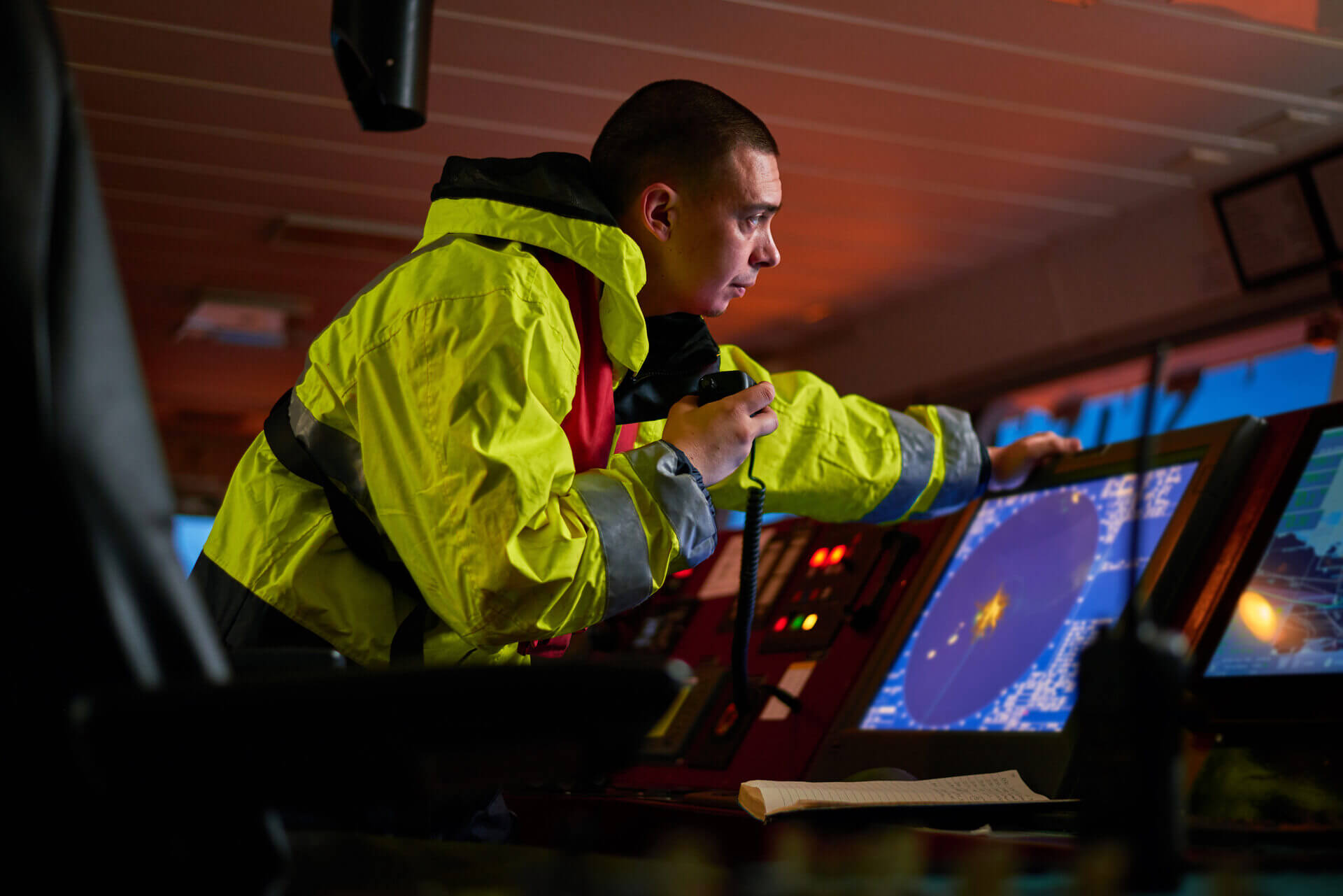 Captain performing daily duties with VHF marine radio