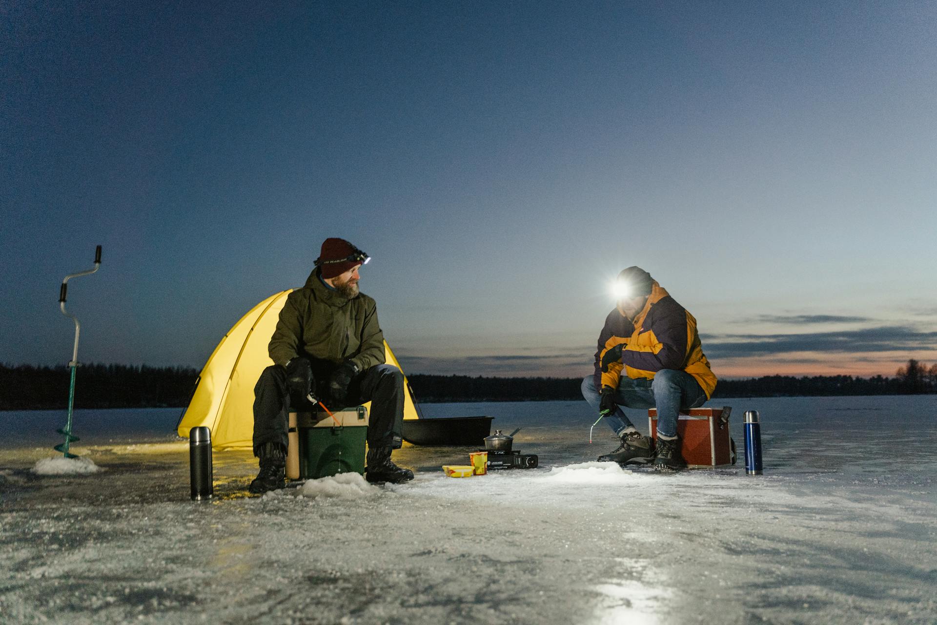 Men fishing in a frozen lake